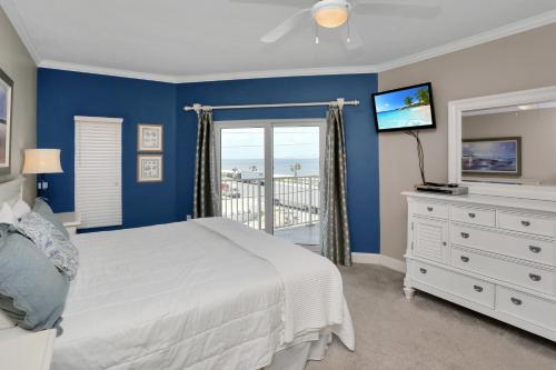 a bedroom with a bed and a window with a view at Paradise Shores 310 by Pristine Properties Vacation Rentals in Mexico Beach