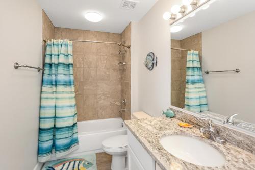 a bathroom with a sink and a toilet at Surfside 17 by Pristine Properties Vacation Rentals in Mexico Beach