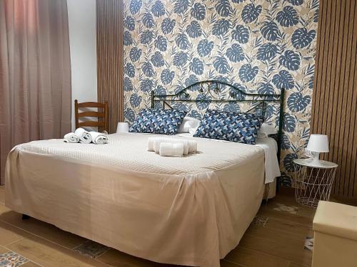 a bedroom with a bed with two towels on it at Chalet del girasole in Castellabate