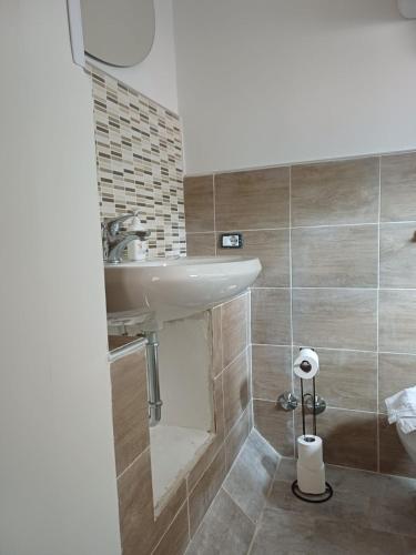 a bathroom with a sink and a toilet at A Taverna Intru U Vicu in Belmonte Calabro
