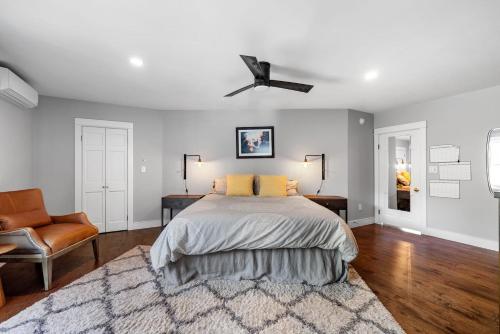 a bedroom with a bed and a ceiling fan at KPT Salt Pine House Apartment in Kennebunkport
