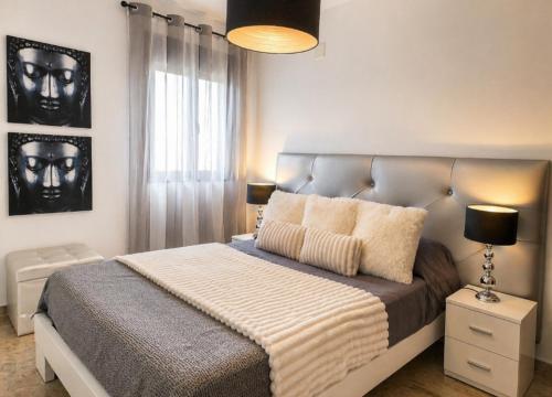 a bedroom with a large bed and a window at El Respiro in Ruidera
