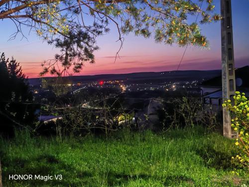 a view of a sunset from a hill with grass at Lacrima del Mare in Zalaegerszeg