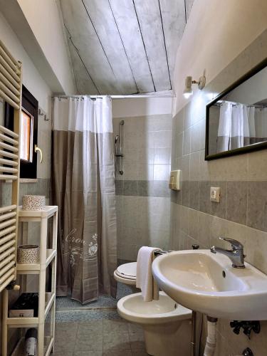 a bathroom with a sink and a toilet and a shower at Nel Cuore di Lanciano - WeclHome in Lanciano