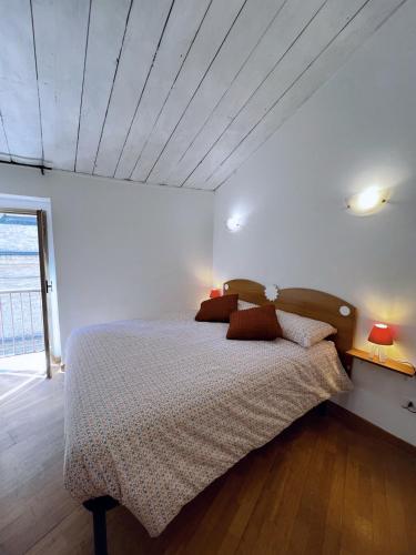 a bedroom with a bed with two lamps on it at Nel Cuore di Lanciano - WeclHome in Lanciano