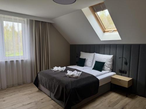 a bedroom with a bed with two candles on it at Zacisze pod Chełmem in Stryszów