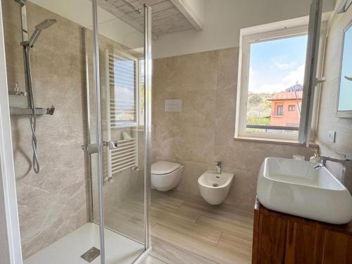 a bathroom with a shower and a sink and a toilet at b&b Il Margonico in Potenza