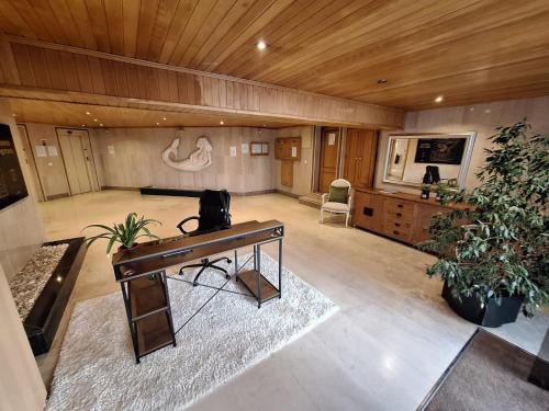 a large room with a desk and a table at Cascais - Localização AC Parking Lift in Cascais