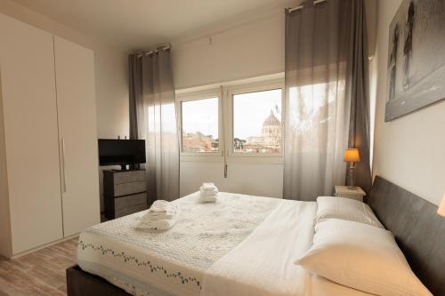a bedroom with a large bed and a window at St Peter Lodge in Rome