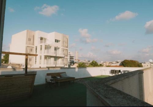 a view of a building from the roof of a building at Rooms next to Florentine with bomb shelter inside the building in Tel Aviv