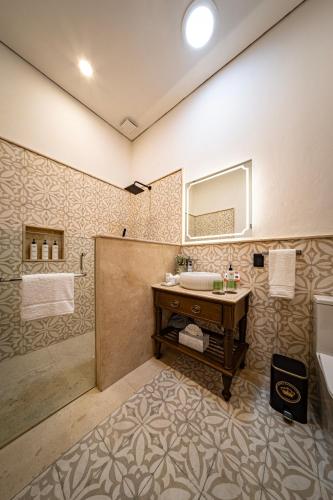 a bathroom with a sink and a shower at Hotel Emperador Orizaba in Orizaba