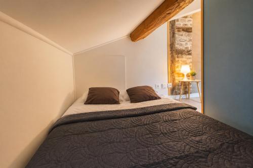 Llit o llits en una habitació de Le studio Bressan