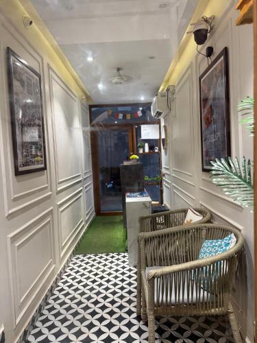 a hallway with a bench in a room at RJ14 Accommodations at Baga Beach in Baga