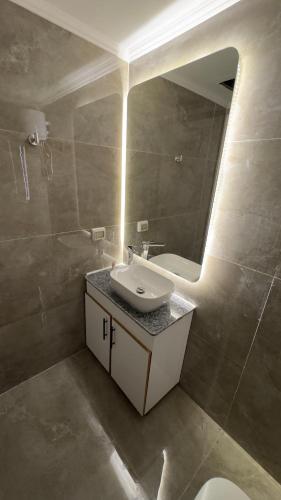 a bathroom with a sink and a mirror at Porto Matrouh unique Chalet in Marsa Matruh