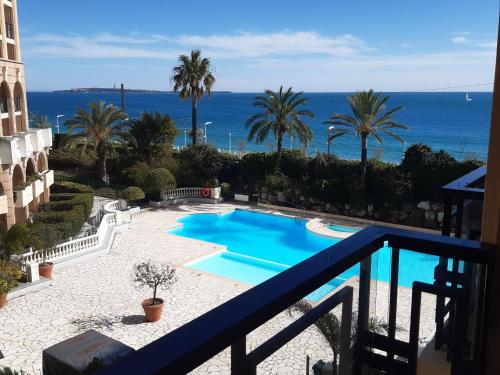 a view of a swimming pool from a balcony at Cannes design vue mer in Cannes