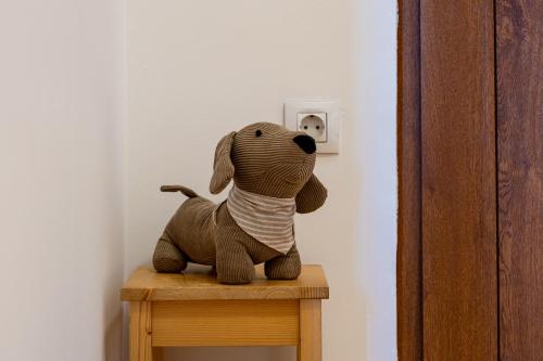 a stuffed dog sitting on top of a table at Pr' Sokrat in Radovljica