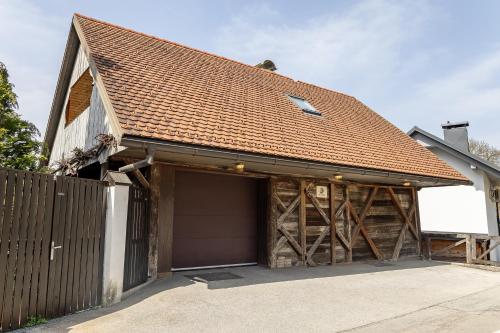 a garage with a brown roof at Pr' Sokrat in Radovljica