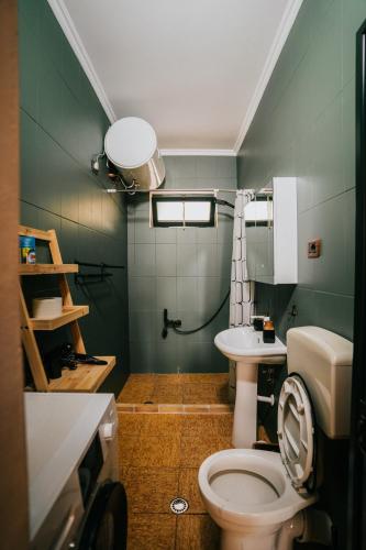 a bathroom with a toilet and a sink at Tirana SkyView in Tirana