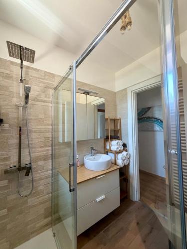 a bathroom with a sink and a shower at Casa Gemelli in San Fedele Intelvi