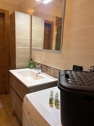a bathroom with a sink and a counter top with a counter top at Il Respiro del Brenta in San Lorenzo in Banale
