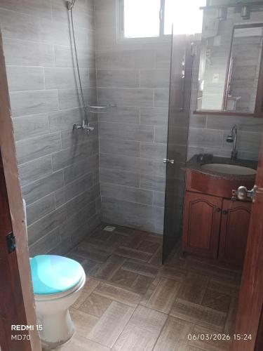 a bathroom with a toilet and a sink at BRISAN descanso sol,y playa in Barra del Chuy