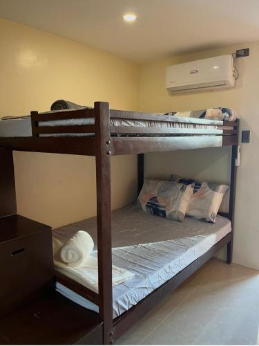 a couple of bunk beds in a room at Studio apartment in Mactan,Cebu-Room201 in Mactan