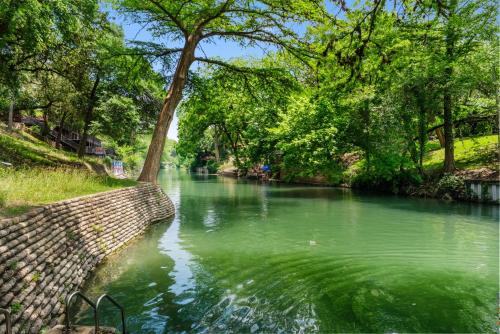 a river with trees on the side of it at Comal Rive Pool Gruene Hall by Barclé in New Braunfels