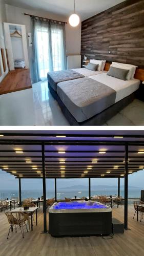 a bedroom with a large bed and a view of the ocean at Blue View Apartments in Kavála
