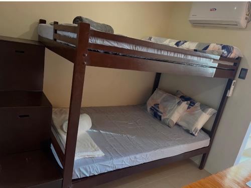 a couple of bunk beds in a room at Studio Apartment in Mactan, Cebu Room304 in Lapu Lapu City