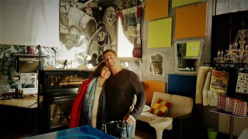 a man and a woman standing in a room at Anahuaska Art - Suites Temáticas in Panzares
