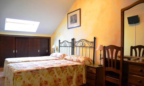 Кровать или кровати в номере Hospedería de Antonia