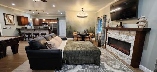 a living room with a couch and a fireplace at The fancy Shanty in Pilot Hill