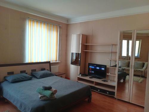 a child laying on a bed in a bedroom at Абай2 103 in Astana