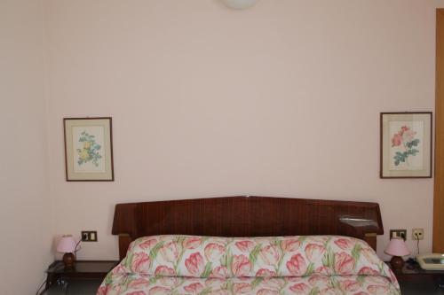 Ένα ή περισσότερα κρεβάτια σε δωμάτιο στο Hotel Vapore
