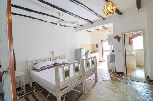 a bedroom with a bed in a room at Watamu Ascot Residence in Watamu