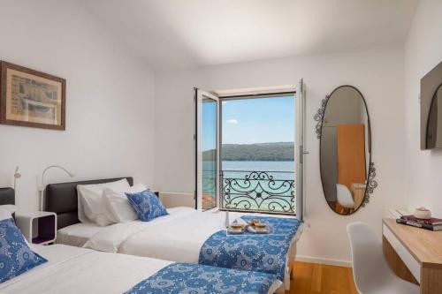 Luxury villa Sea Whisper steps from beach with indoor & outdoor pools near Šibenik