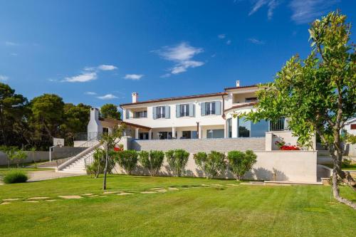 Luxury villa Sea Whisper steps from beach with indoor & outdoor pools near Šibenik