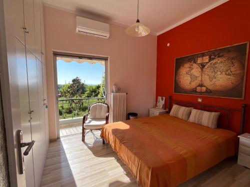a bedroom with a large bed and a window at Vivian Philoxenia in Néa Sampsoús