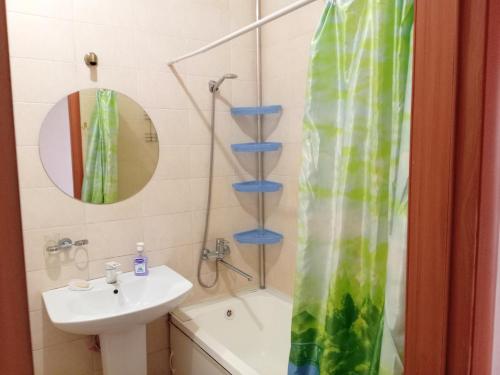 a bathroom with a sink and a shower and a sink at Абай2 169 in Astana
