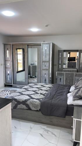a large bedroom with a large bed in it at Airport sky in Amman