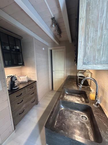 a kitchen with a sink and a counter top at Californian style chalet in Gassin