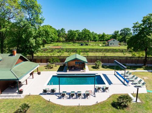 an overhead view of a pool with chairs and a house at Oria Retreat in Danilovgrad