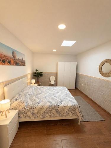 a bedroom with a bed in a room at Costacabana Sea Apartment in Almería