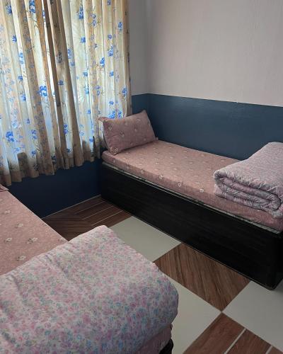 a room with two bunk beds in a room at Hotel Sakura in Jomsom