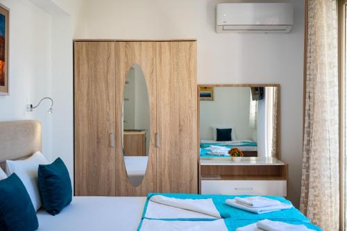 a bedroom with a bed and a large mirror at Villa Ines in Budva