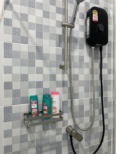 a bathroom with a shower stall with a shower at 529 Cozy rooms in Ban Si Than