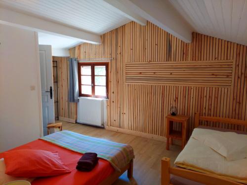 a bedroom with a bed and a window at Auberge de Miélandre in Teyssières