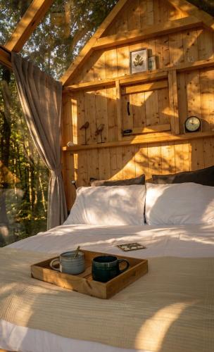 a wooden tray on a bed in a room at Agriturismo Verdesole in Civitella San Paolo