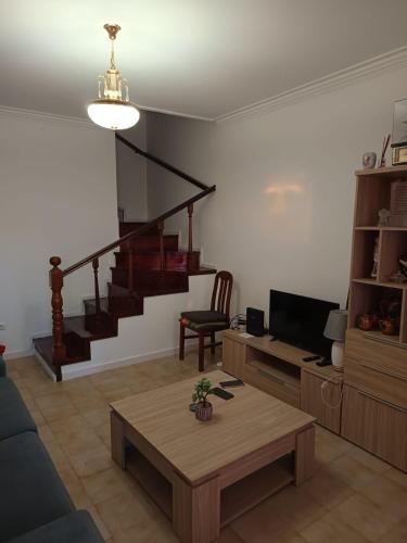 a living room with a couch and a table at O Fernando in Caminha