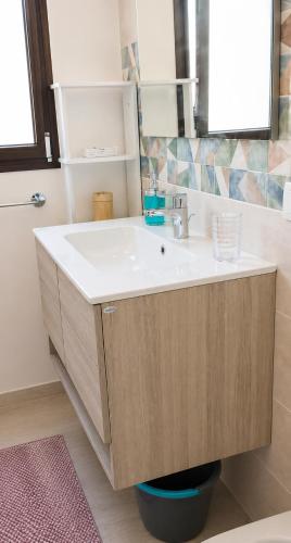 a bathroom with a sink and a mirror at Sosta al 101 - Alloggio turistico in Grammichele